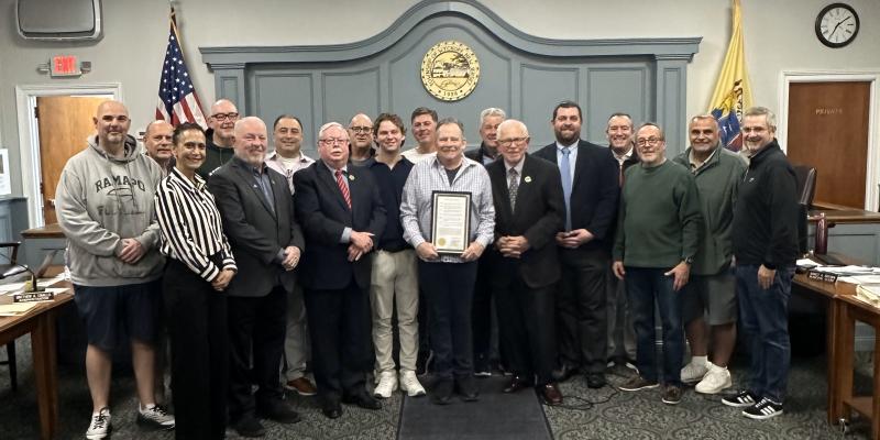 Howard Felixbrod with the Township Committee and his friends and family.